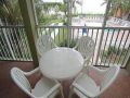 Screened balcony with table set