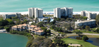A private, Longboat Key pristine white-sand beach with complimentary chaise lounge chairs, cabanas, and umbrellas