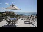 Deck with table set & lounging chairs