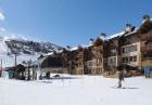 Chair Lift Steps Out Building Door