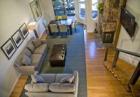 Open Plan living room with wood floors throughout , high end ski accommodation